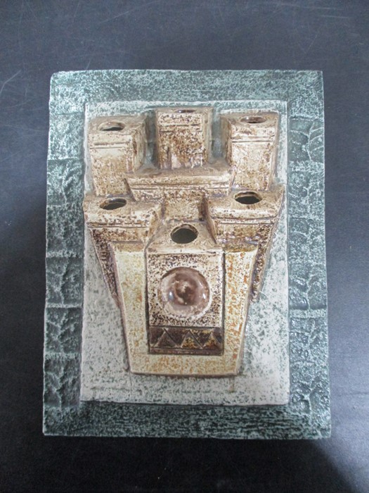 A Troika six aperture wall plaque decorated by Alison Bridgen, rectangular form, cast in low