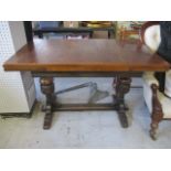 An oak refrectory style draw leaf table