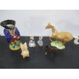 An assortment of collectables including a Toby jug, two Beswick horses, Artone etc.