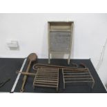 A vintage washboard along with crooks, ladels etc.