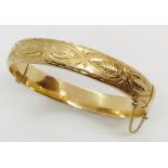 A 9ct gold hinged bracelet. Weight 12g