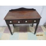 A Victorian two drawer side table