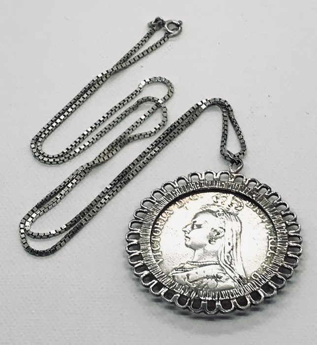 A Victorian 1889 Crown in pendant mount and silver chain. Total weight 44.9g