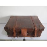 A large vintage Harrods leather suitcase