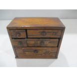 A miniature parquetry chest of drawers - A/F