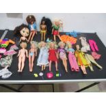A collection of various vintage dolls including three Sindy dolls