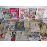 A collection of Picture Postcard Monthly and Punch magazines, along with a small selection of tea