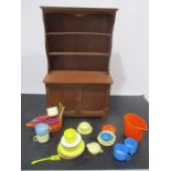 A child's miniature dresser along with a plastic part tea set etc.