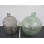 One large glass carboy along with a large antique glass bottle