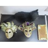 Two venetian style masks, a vintage toy cat, and a cigar box and contents.