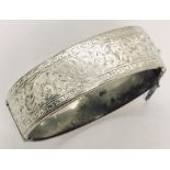 A hallmarked silver hinged bracelet. Weight 28.7g