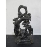 A cast iron doorstop decorated with a fox mask, riding crop etc.