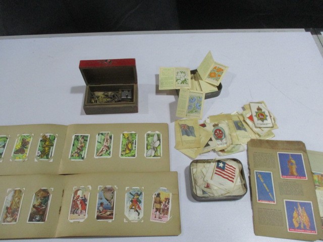 A collection of cigarette cards ( including Turf, Lawn Virginia Cigarettes, Gallagher etc.) along