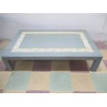 A contemporary coffee table with mosaic design