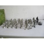 A selection of thirty one Pewter figures including three mounted indian warriors, twenty