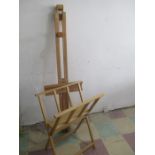 A large Daler Rowney artists easel along with a folio stand