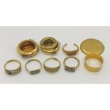 A collection of 18ct gold including a large wedding band, watch cases (one set with diamonds)