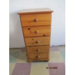 A pine chest of five drawers