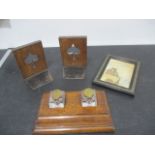 A wooden writing set including glass inkwells, wooden bookends and sand picture in frame