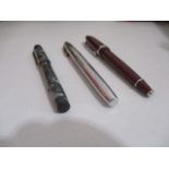 A collection of three fountain pens including Sheaffer, Cross & Conway Stewart