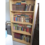 A large collection of various books - over four shelves