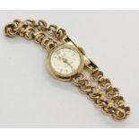 A 9ct gold Accurist ladies watch with a 9ct gold strap. Total weight including movement 14.2g
