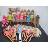 A collection of vintage Barbie and other similar dolls