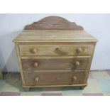 An antique pine chest of three drawers