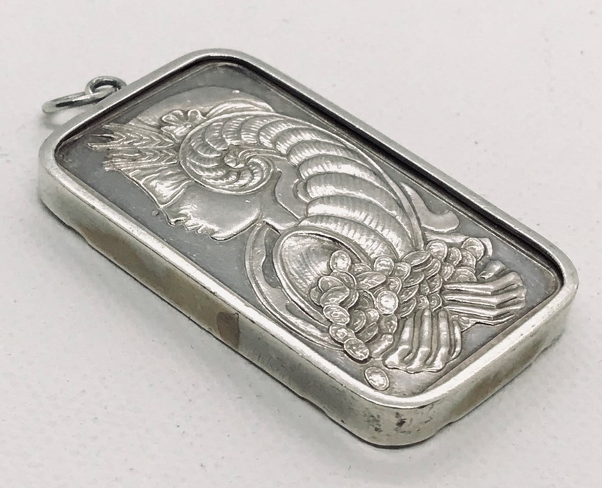 A 50g fine silver ingot in pendant mount. Weight 55.5g