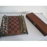 A cast metal chess set and board in the form of Cavaliers, both kings A/F