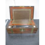 A Victorian mahogany brass bound writing slope with secret drawer