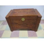 A large carved wooden chest with oriental decoration 101cm (l) 59cm (d) 65 (h)