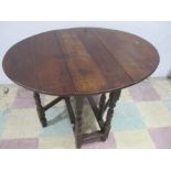 A small antique oak gateleg table with peg joints