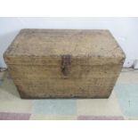 A small antique pine trunk with brass handles