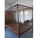An Oriental hardwood four poster bed