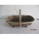 A vintage wooden trug