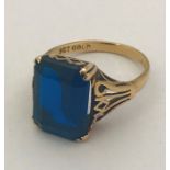 A 9ct gold Victorian style ring set with a deep blue stone