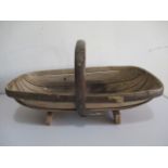 A rustic wooden trug