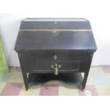 An antique ebonised rent collectors desk with secret drawer to inner