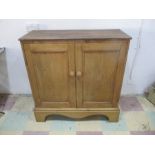 A pine two door cupboard