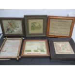 A collection of various framed embroidery including some samplers