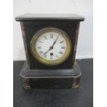 A small slate mantle clock