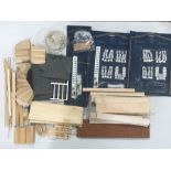 A collection of dolls house materials- wiring systems, electric lights, building materials etc.