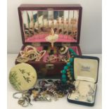 A collection of costume jewellery including a silver ID bracelet.