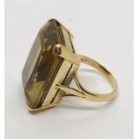 A 9ct gold ring set with a large smoky topaz