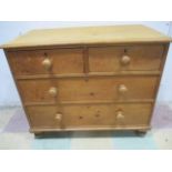 A pine chest of four drawers