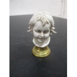 A miniature porcelain bust of a child by Benacchio