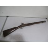 An antique percussion cap muzzle loading musket with attached ramrod, length 93cm. Trigger guard