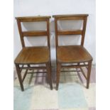 A pair of elm chapel chairs