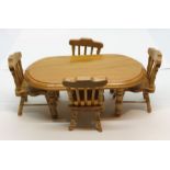 A dolls house dining table and 4 chairs